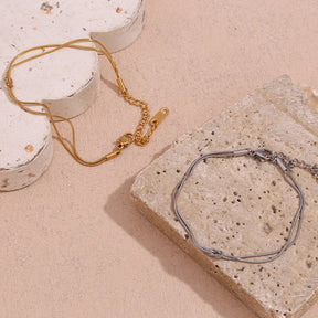 Pulseira Dupla Burnetts Joias: Elegância em Aço Inoxidável
