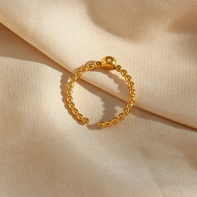 Anel Elegante de Zircônia com Esferas Douradas