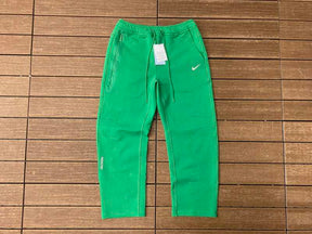 Calça Nike x NOCTA Tech Fleece Stadium Green/Sail